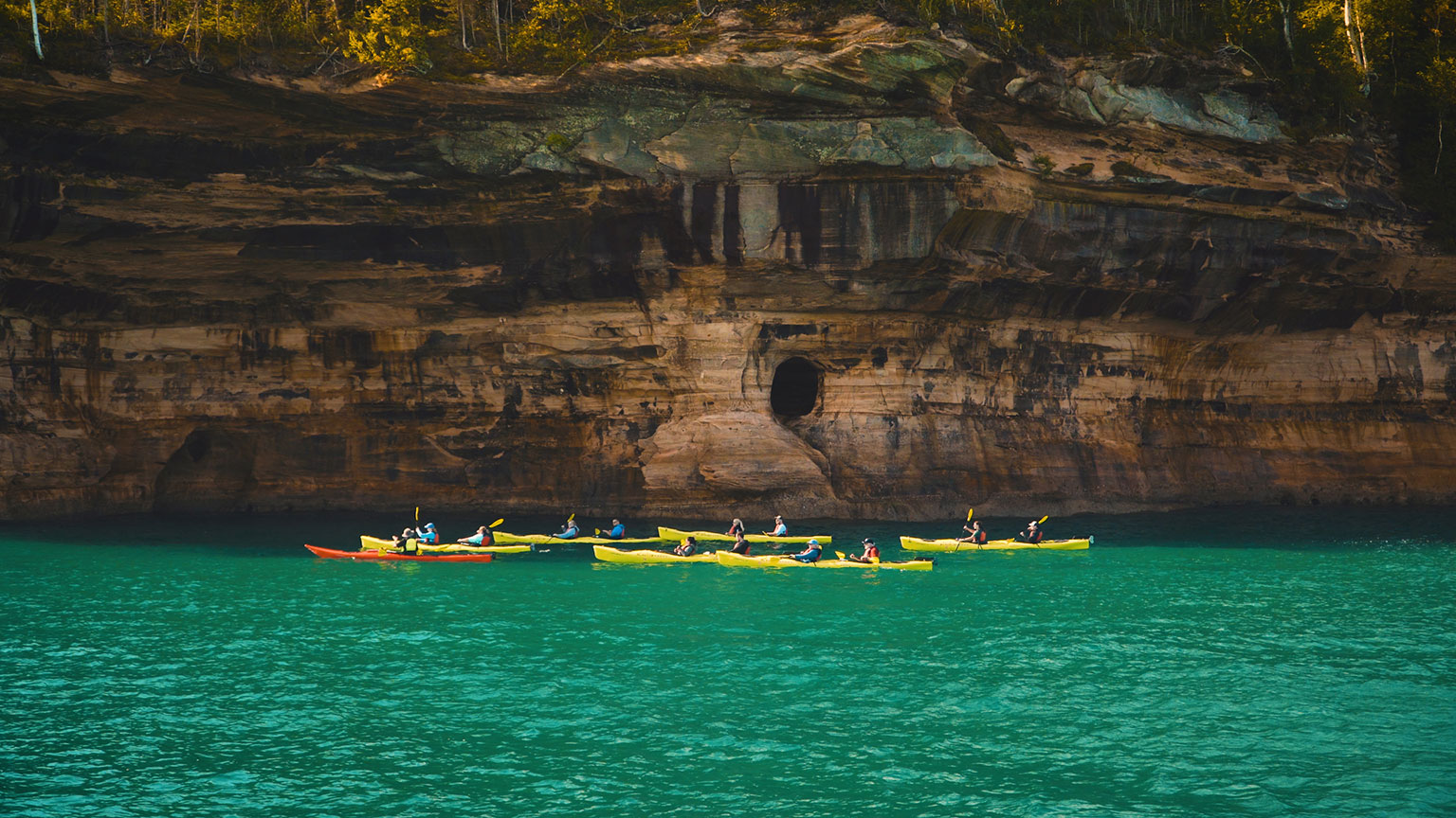 A kayaking tour peering at one of the rock formations. PC: Instagram user @little_pioneer