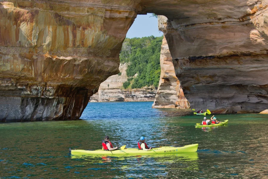 Paddlers experience Lovers Leap up-close and personal on a Pictured Rocks Kayaking tour.